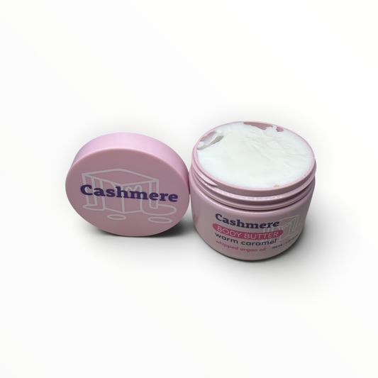 Open jar of Cashmere Warm Caramel Whipped Argan Oil Body Butter showing whipped texture